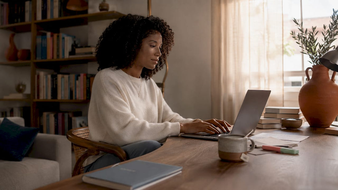Woman working at a dedicated home office desk